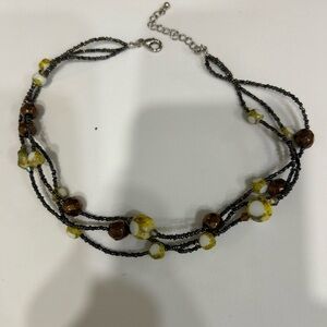 Elegant Beaded Necklace with Yellow and Brown Accents